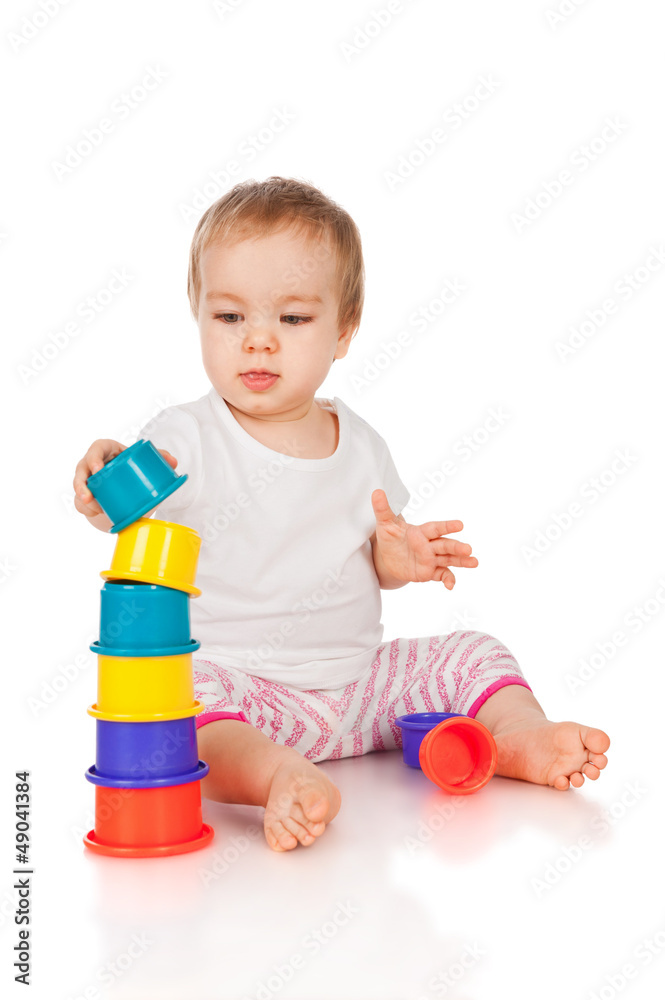 Little girl with a toys, isolated on white Little girl with a toys, isolated on white