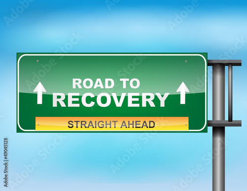 Highway sign with "Road to recovery " text