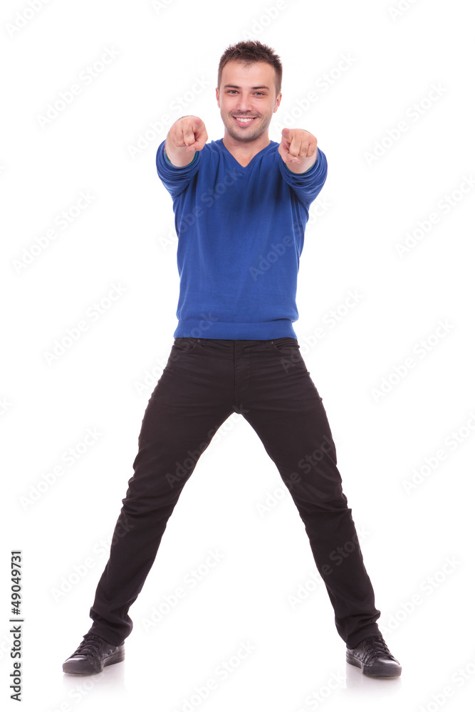 young man pointing at the camer young man pointing at the camer