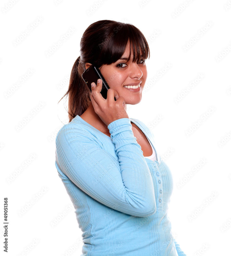 Young woman with fringes speaking on cellphone Young woman with fringes speaking on cellphone
