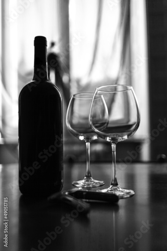 Glasses and wine bottle B&W image