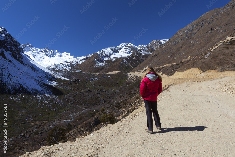 Woman enjoying view of Tsopta Valley, North Sikkim. Woman enjoying view of Tsopta Valley, North Sikkim.