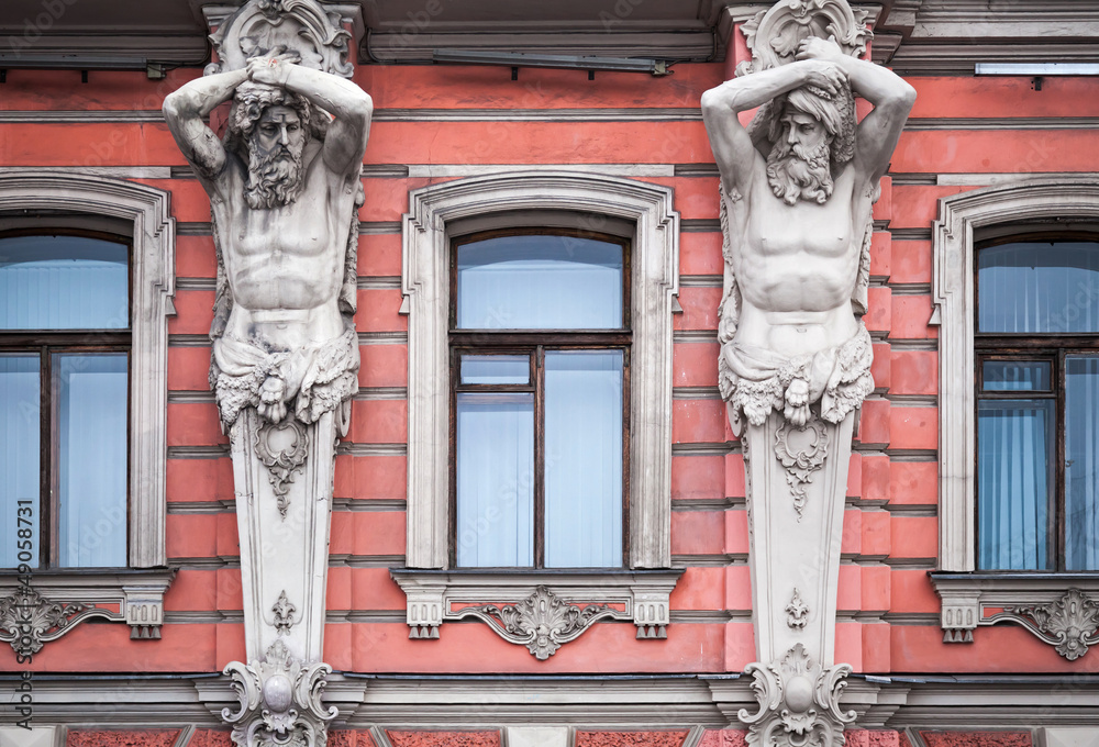 Obraz premium Facade with men statues. Old palace in St.Petersburg, Russia
