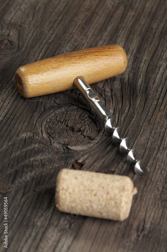фотографія Wine corks with corkscrew on wooden table
