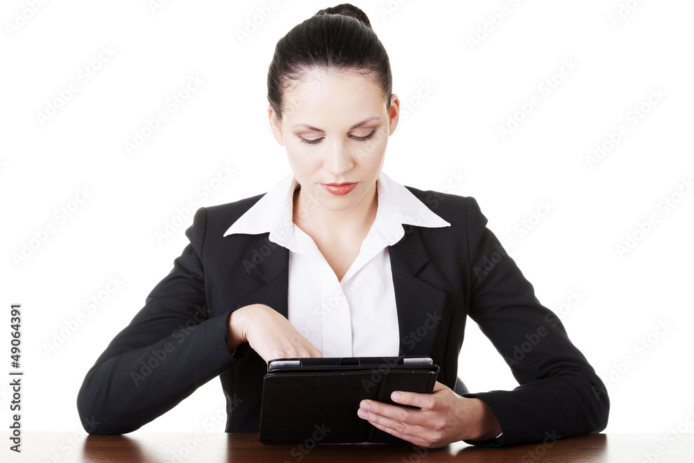 Business woman working on tablet computer Business woman working on tablet computer