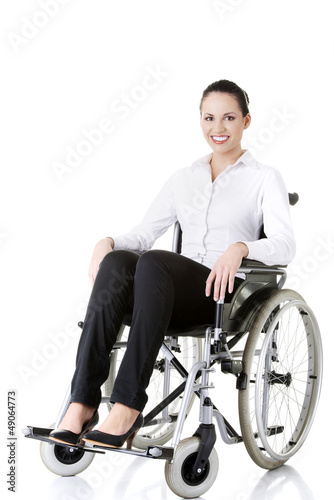 Attractive disabled businesswoman sitting in a wheel chair