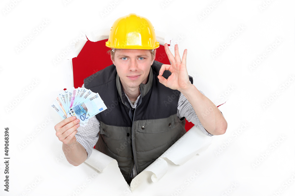 craftsman holding money and making an okay sign craftsman holding money and making an okay sign