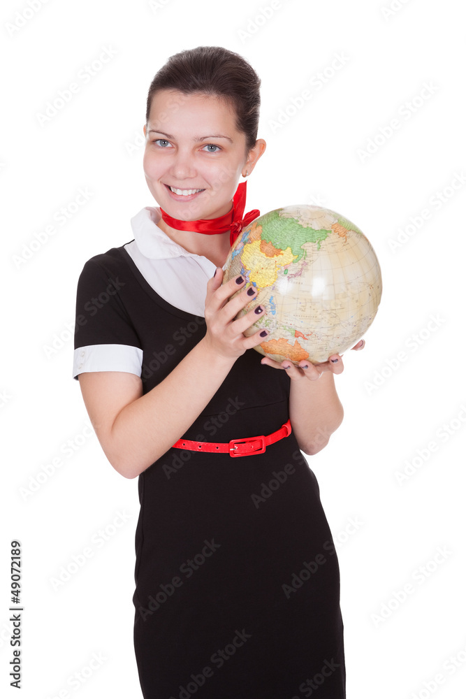 Pretty flight attendant holding a globe Pretty flight attendant holding a globe