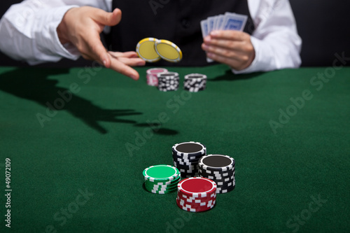 Poker player increasing his stakes