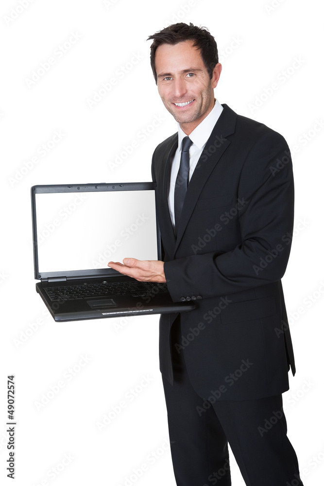Happy middle aged businessman with laptop Happy middle aged businessman with laptop