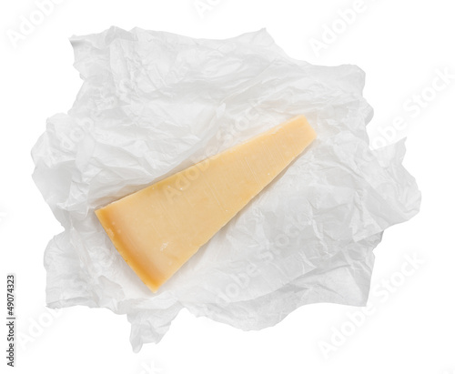 Parmesan cheese wedge in paper