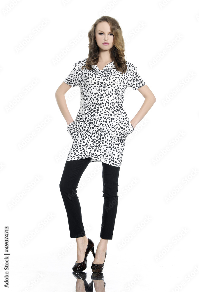 Full body young woman in casual clothes posing in studio Full body young woman in casual clothes posing in studio