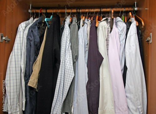 open closet with many elegant shirts for important meetings