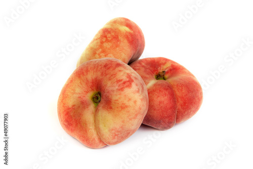 Three ripe fig peach on white