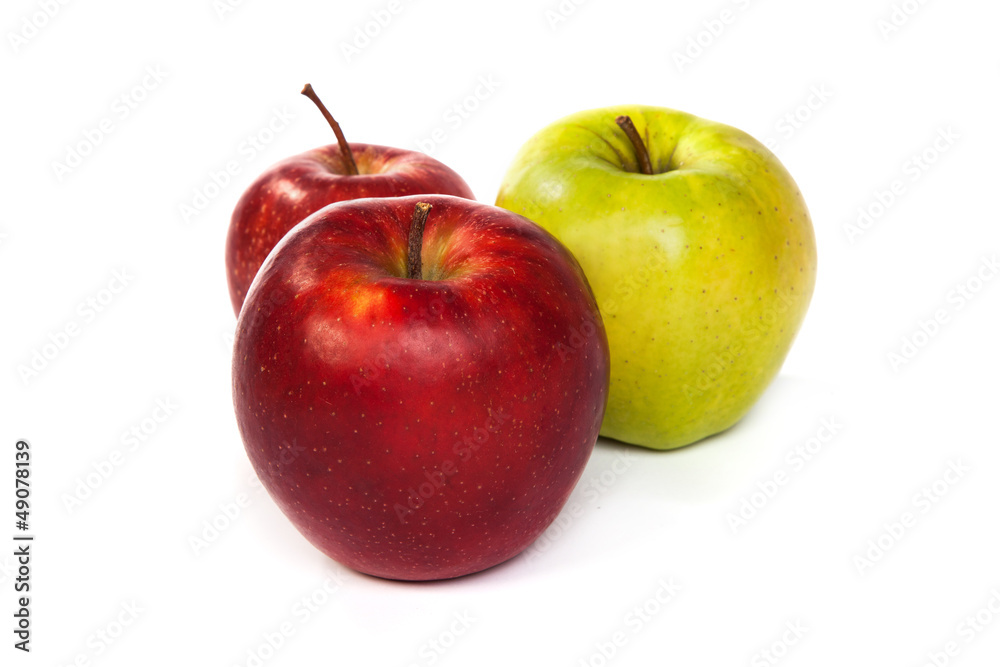 A shiny red and green apples isolated on white A shiny red and green apples isolated on white