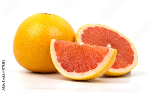 Cut red grapefruit isolated on white background