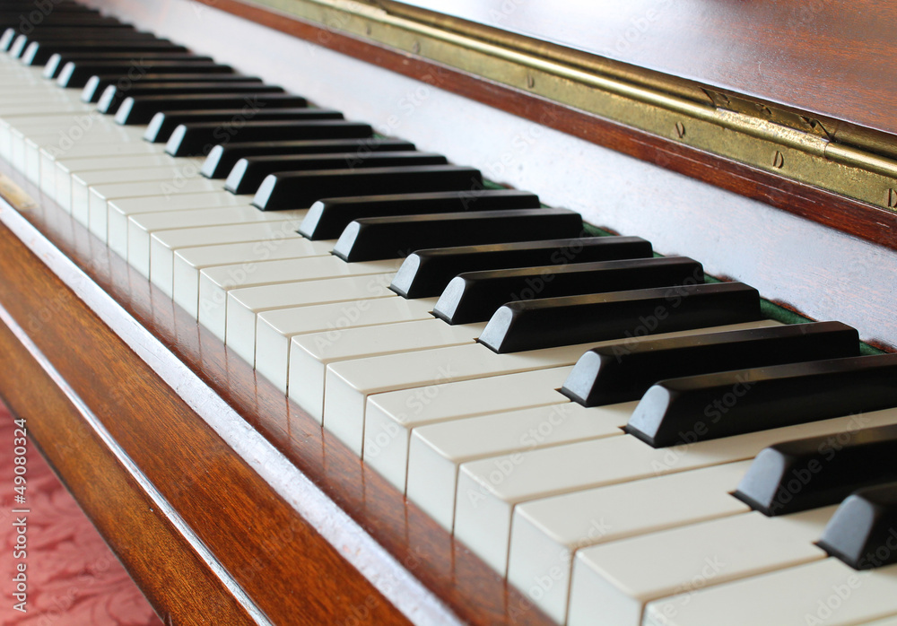 Piano key closeup on a wooden piano Piano key closeup on a wooden piano