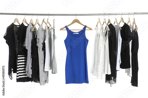 A row of summer clothes hanging on the rack