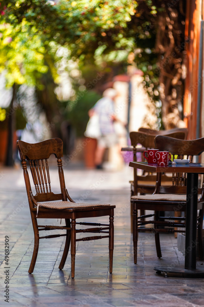 Empty coffee terrace with tables and chairs