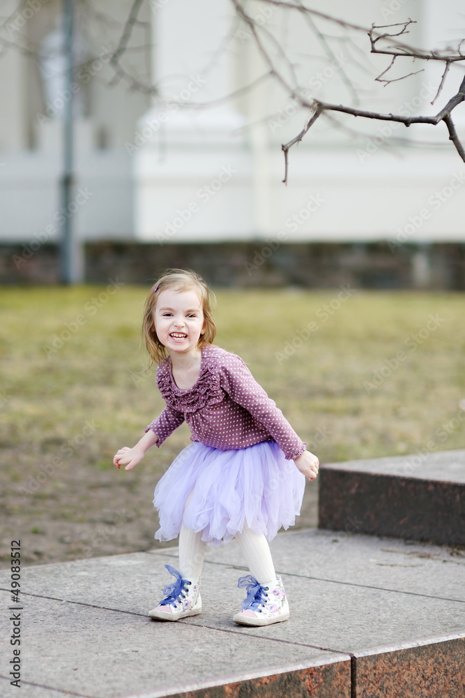 Fototapeta premium Adorable girl having fun on spring