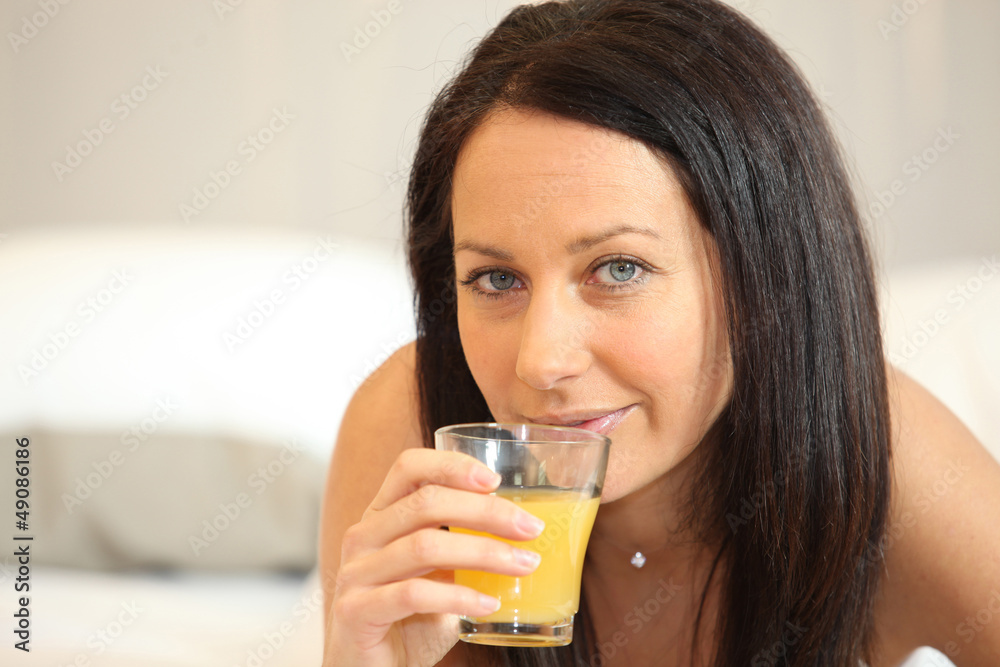 Brunette woman with orange juice Brunette woman with orange juice