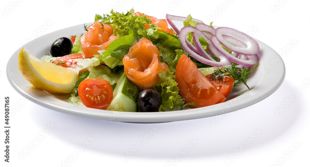 Salad with salmon served on white plate Salad with salmon served on white plate