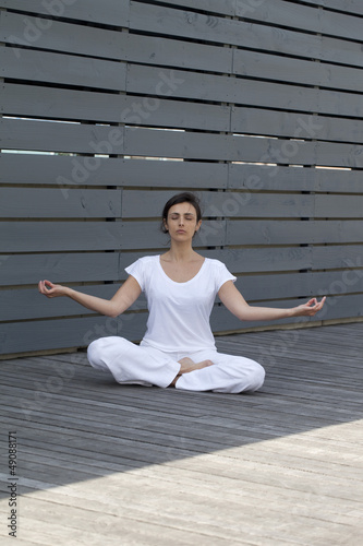 young woman breathing in peace outdoors