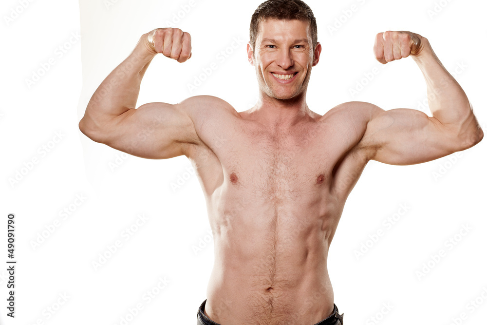 young sexy muscular macho man posing with naked torso on white young sexy muscular macho man posing with naked torso on white