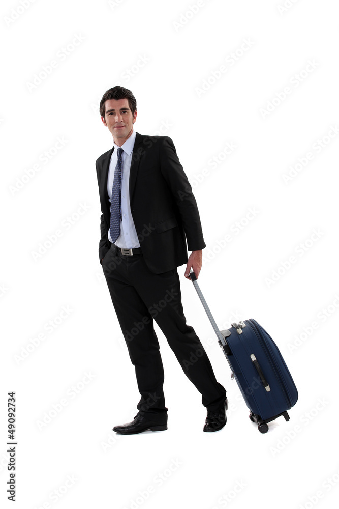 A businessman with his luggage. A businessman with his luggage.