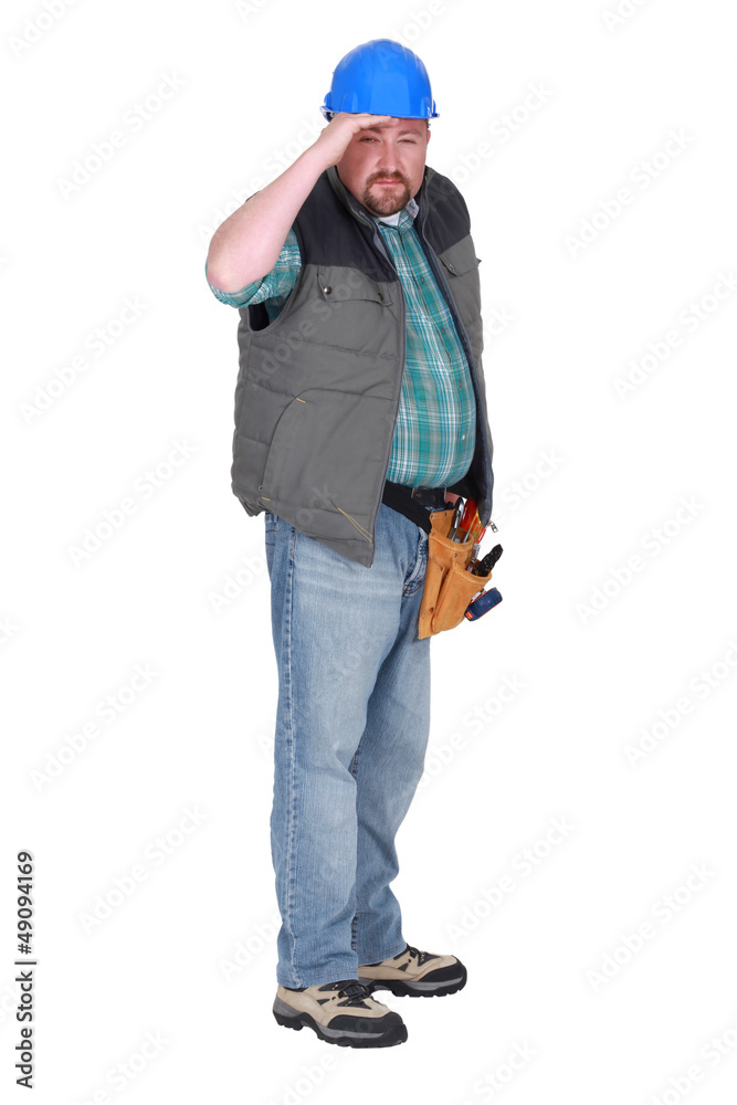 Construction worker squinting into the distance Construction worker squinting into the distance