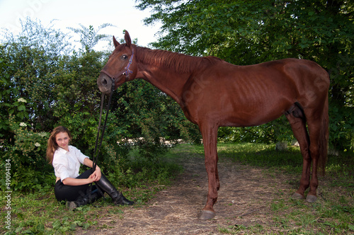 girl in a shirt and a horse