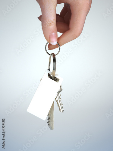 Hand holding keys, room for text or coopy space photo