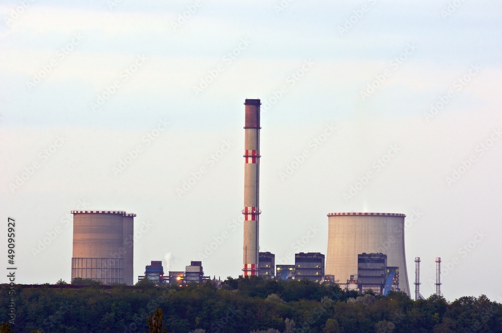Nuclear power station at dusk with cooling towers Nuclear power station at dusk with cooling towers
