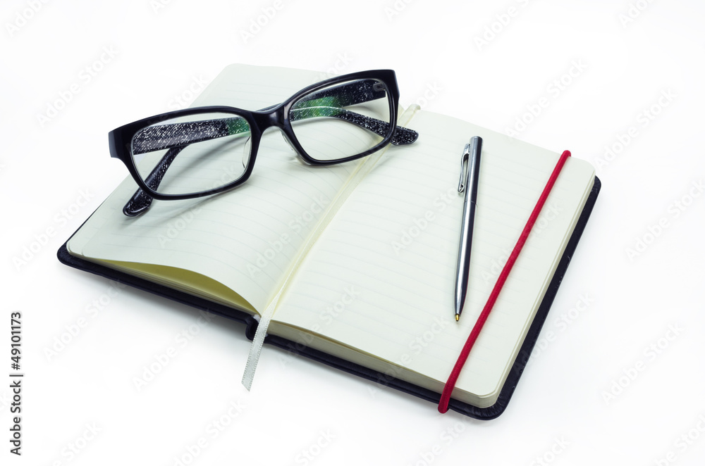 Pencil and black frame glasses on the notebook Pencil and black frame glasses on the notebook