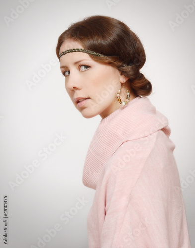 Portrait of young woman in pink sweater © Tvish