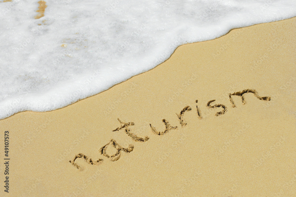 Fototapeta premium Naturism handwritten in sand