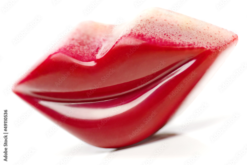 Burgundy Lips shaped Praline on white background. Burgundy Lips shaped Praline on white background.