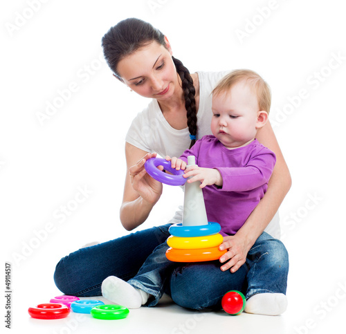baby girl and mother playin...