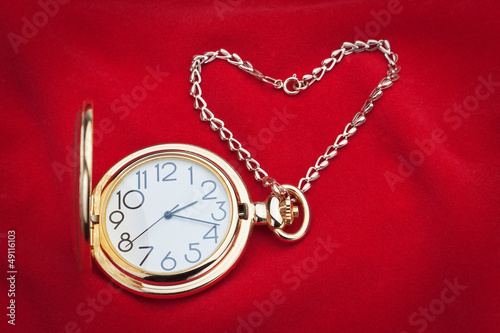Pocket watch and silver chain.