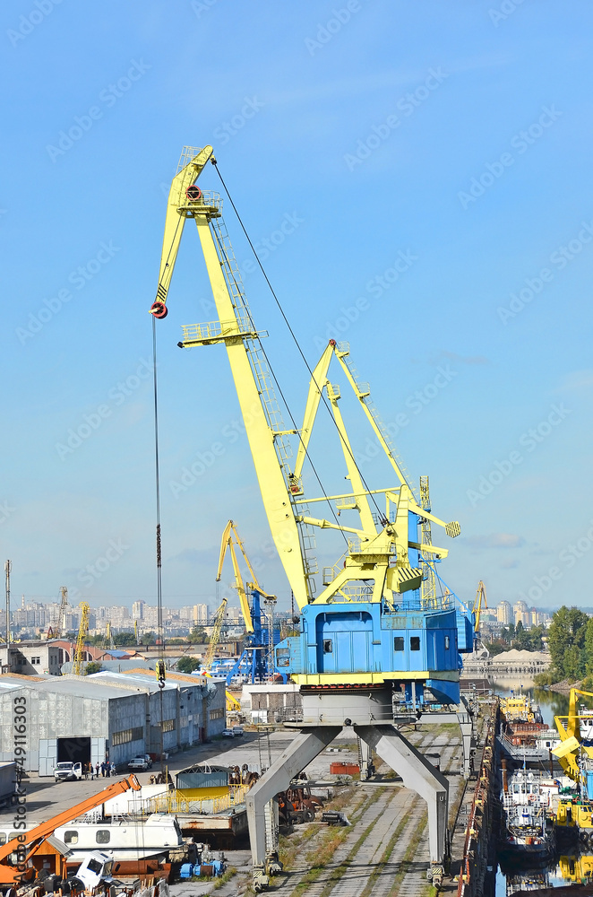 Port cargo crane over blue sky background Port cargo crane over blue sky background