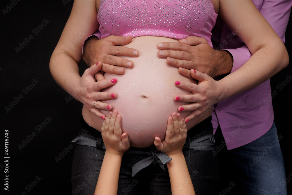 pregnant woman with a family.