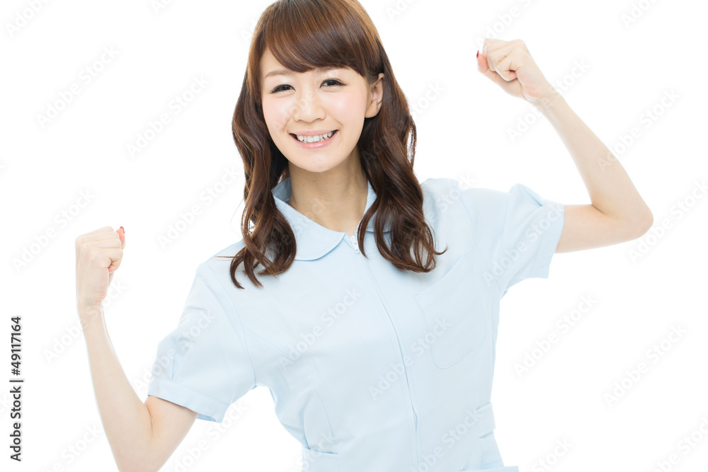 Beautiful young nurse on white background