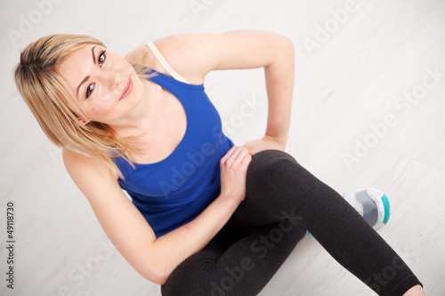 Slim woman exercising in a gym