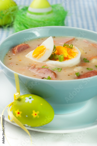 White borscht with eggs and white sausage.Polish easter soup