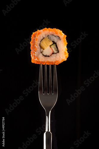 a fresh sushi, maki on a black background