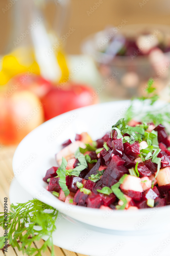 nutritious salad with beets in a white bowl