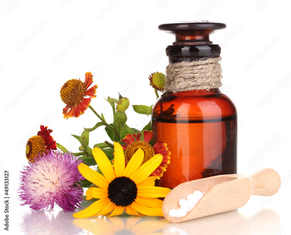 medicine bottle with tablets and flowers isolated on white medicine bottle with tablets and flowers isolated on white