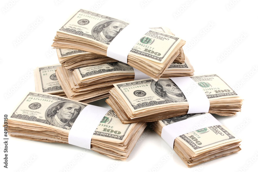 Stacks of one hundred dollars banknotes close-up isolated Stacks of one hundred dollars banknotes close-up isolated