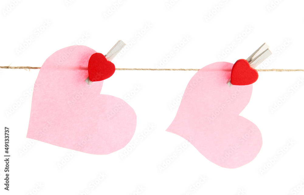 two paper hearts on rope, isolated on white two paper hearts on rope, isolated on white