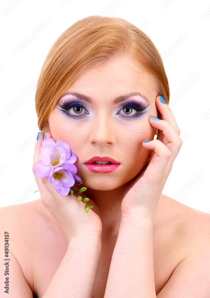 Beautiful young woman with glamour make up and flower, isolated